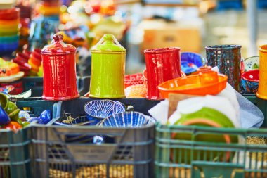 Colorful clay crockery on a farmer market in Cucuron, Provence, France