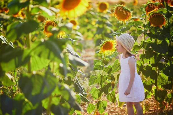 Adorable Year Old Girl White Dress Straw Hat Field Sunflowers — Stock fotografie