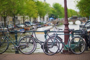 Lots of bikes parked on the bridges and embankments in Amsterdam, the Netherlands