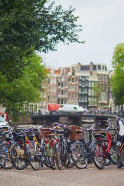 Lots of bikes parked on the bridges and embankments in Amsterdam, the Netherlands
