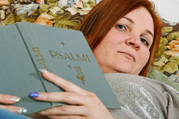 Woman with holly book. — Stock Photo, Image