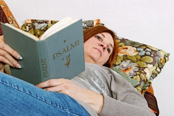 Woman with holly book. — Stock Photo, Image