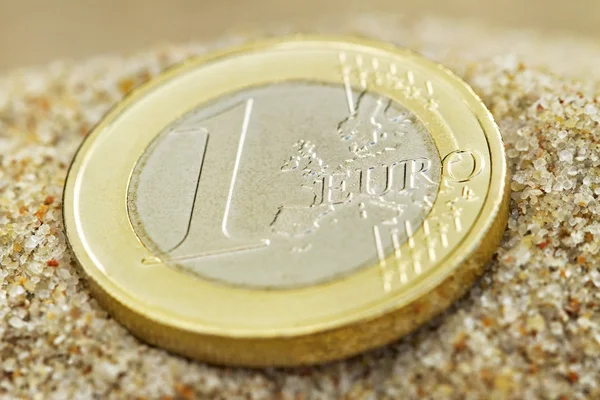 Euro coin on sand. — Stock Photo, Image