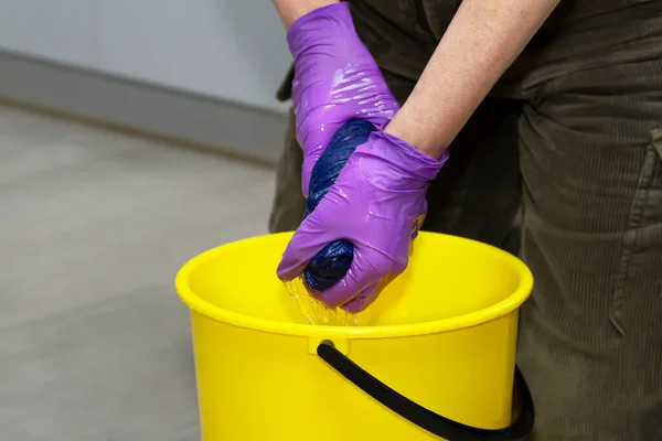 Woman Squeezes Floor Cloth Yellow Bucket — Stock Photo, Image