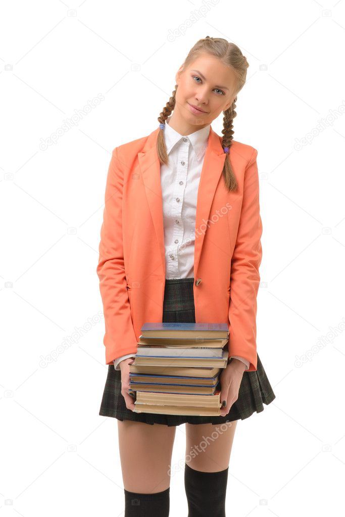 Beautiful blonde girl student holds a stack of books