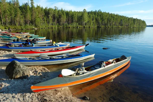 Colorful canoes on lake,Polar Karelia, Russia — Stock Photo, Image