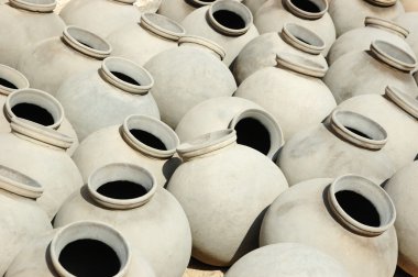 Big grey ceramic jars produced by Bishnou people,India,Rajasthan clipart