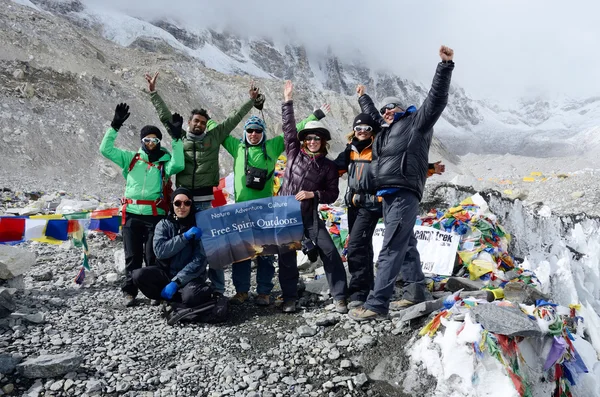 Hikers finishing trek to first Everest Base camp,Nepal. This place is final point of the Everest Base Camp Trek,one of most popular routes in the world — Stock Photo, Image