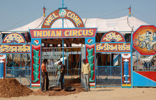 People are having fun at indian circus during traditional camel mela in Pushkar, Rajasthan, India