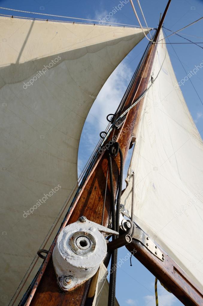 Boat standing and running rigging - mainsail,backstay,pulley blocks,winch,rope and guy lines