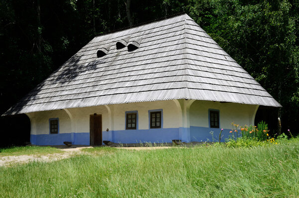 Traditional medieval Ukrainian wattle and daub house with hay roof in Pirogovo park,Ukraine,Europe, unesco heritage