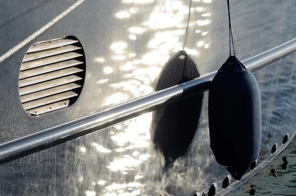 Blue boat fender - tool for protecting the side of a sailing vessel as it heads into port — Stock Photo, Image