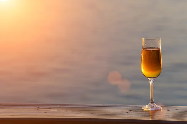 Glass of wine at sea — Stock Photo, Image