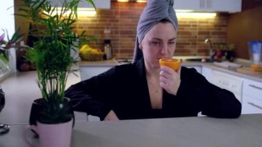 Sick woman trying to sense smell of fresh orange