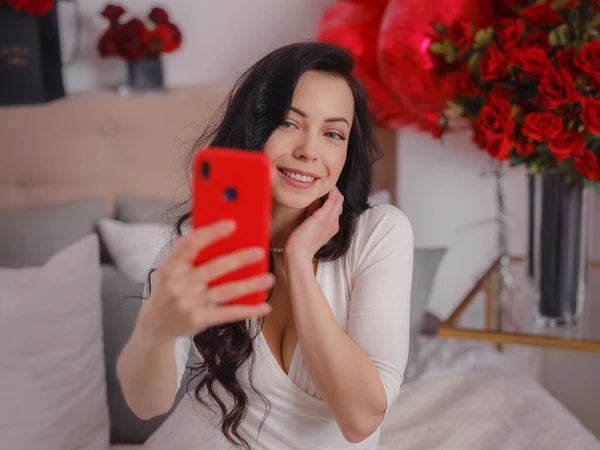 Young Woman White Dres Taking Selfie Smartphone Sitting Bed Morning — стокове фото