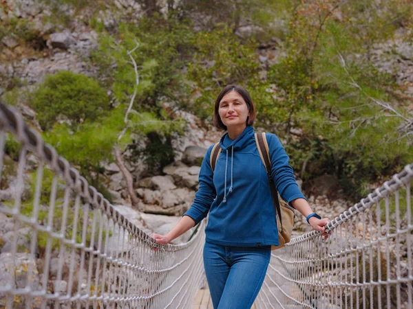 travel to Turkey, Kemer in autumn seasone. famous part of Lycian Way, Goynuk Canyon. Woman hiker trekking in mountains. Young lady walking with backpack in forest.