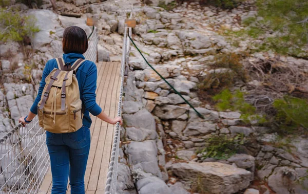 travel to Turkey, Kemer in autumn seasone. famous part of Lycian Way, Goynuk Canyon. Woman hiker trekking in mountains. Young lady walking with backpack in forest.