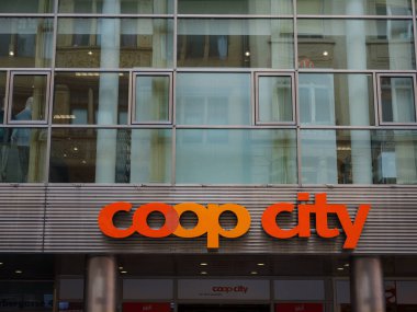Basel, Switzerland - July 4 2022: Coop sign on a store building. The Coop Group is one of Switzerlands largest retail and wholesale companies for groceriies and daily products.