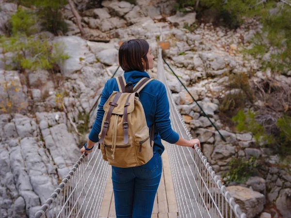 travel to Turkey, Kemer in autumn seasone. famous part of Lycian Way, Goynuk Canyon. Woman hiker trekking in mountains. Young lady walking with backpack in forest.