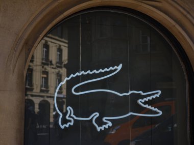Bern, Switzerland - July 4 2022: Closeup of Lacoste sign on store front, Lacoste is the famous french chain of luxury polo