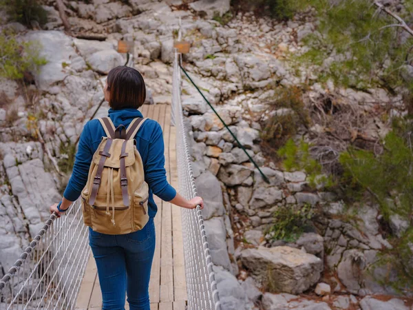 travel to Turkey, Kemer in autumn seasone. famous part of Lycian Way, Goynuk Canyon. Woman hiker trekking in mountains. Young lady walking with backpack in forest.