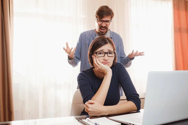 Portrait of attractive mad furious coworkers having fight crisis, scolding finance fail failure at living-room. couple shouting, having fight or dispute, Negative emotions, problems in relationships