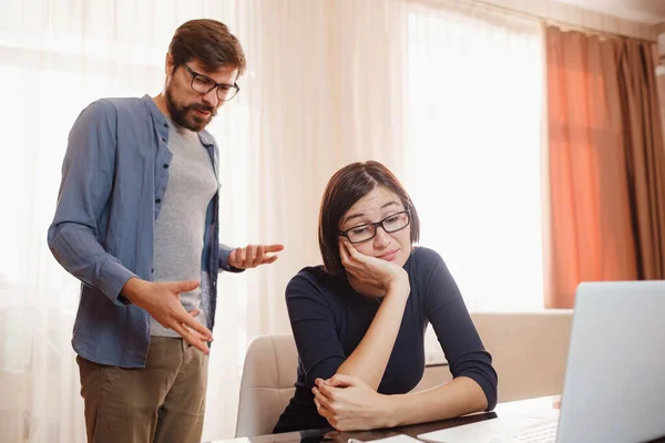 Portrait of attractive mad furious coworkers having fight crisis, scolding finance fail failure at living-room. couple shouting, having fight or dispute, Negative emotions, problems in relationships