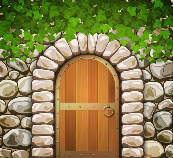 Pared de piedra con puerta de madera medieval arqueada y hojas — Vector de stock