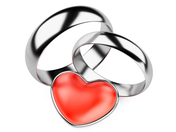 Silver wedding rings and red heart — Stock Photo, Image
