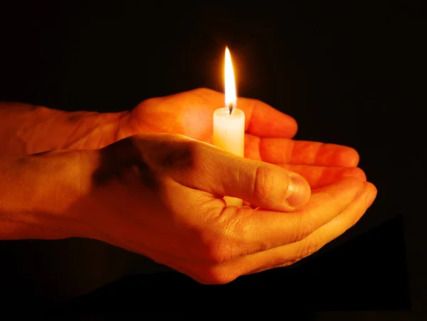 Candle in a hand Royalty Free Stock Images