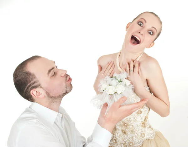 Beautiful wedding couple - groom and surprised bride Stock Photo