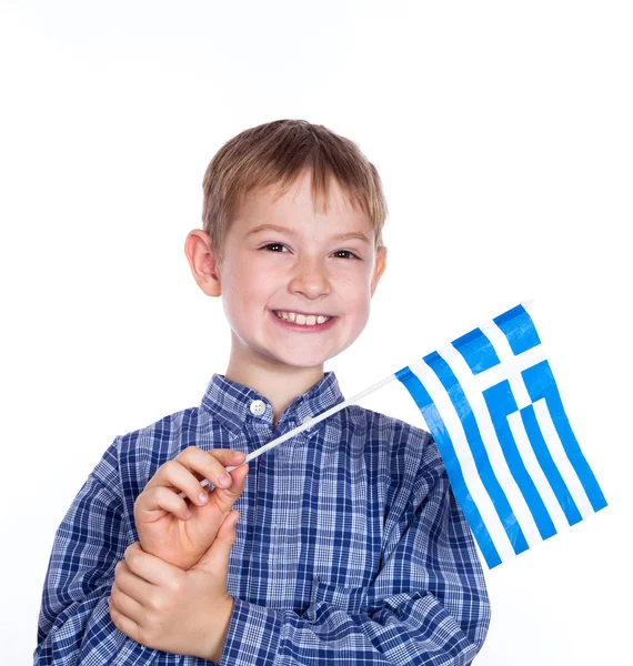 Um menino com bandeira grega no fundo branco — Fotografia de Stock