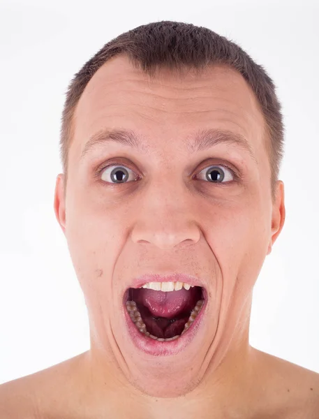 Humorous emotional portrait of grimacing young man — Stock Photo, Image