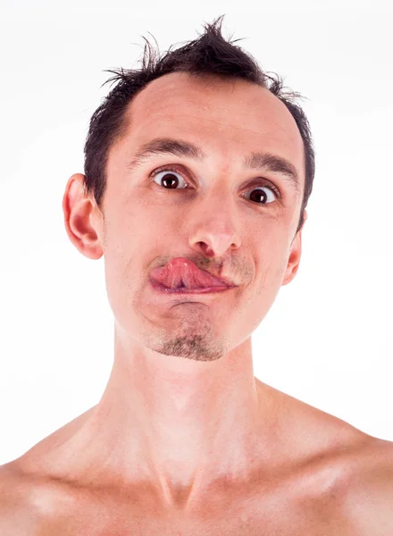 Humoristische emotionele portret van grijnzende jonge man — Stockfoto