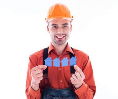 holding kağıt evler bir Oluşturucu adam.