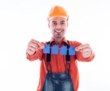 holding kağıt evler bir Oluşturucu adam.