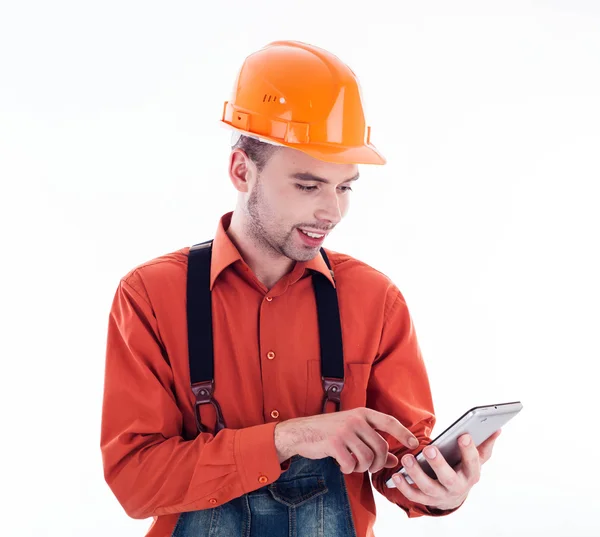 Un constructor con una tableta —  Fotos de Stock