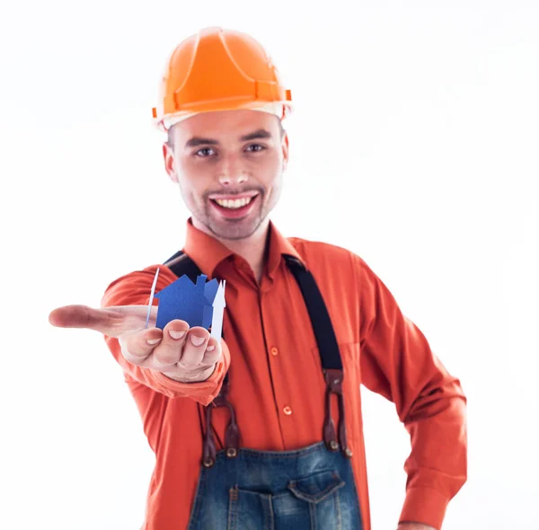 A builder man holding a paper house. Royalty Free Stock Images