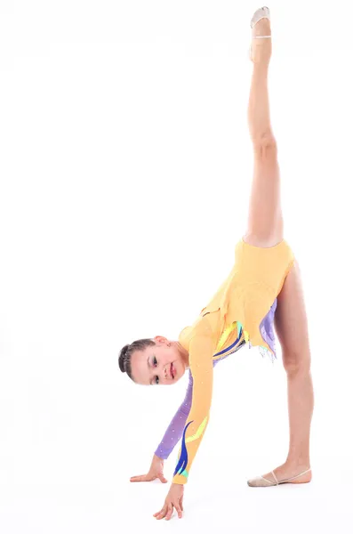 Mooi flexibele meisje gymnast op witte achtergrond — Stockfoto