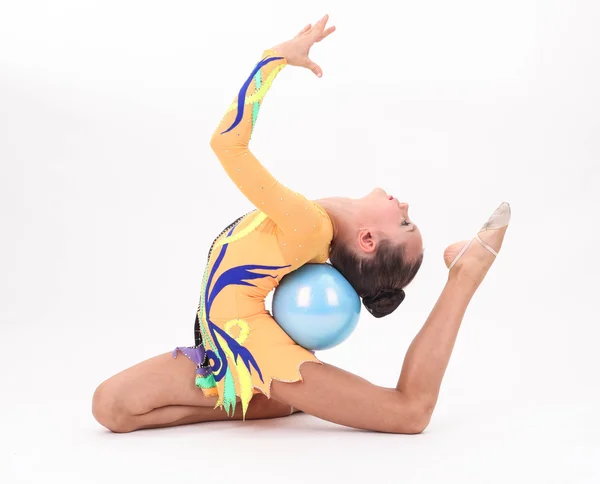 Mooi flexibele meisje gymnast op witte achtergrond — Stockfoto