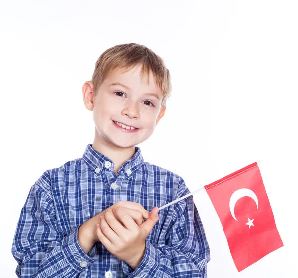 A little boy with turkish flag on the white background — Stock Photo, Image