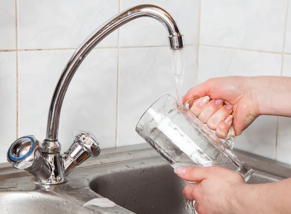 Washing of a beer glass — Stock Photo, Image