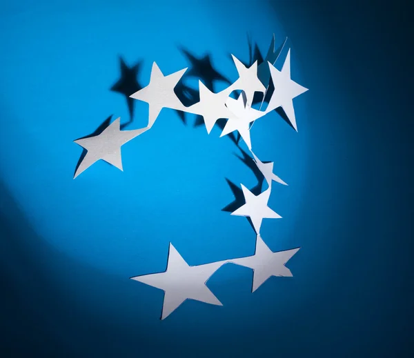 Paper stars group on a colour background — Stock Photo, Image