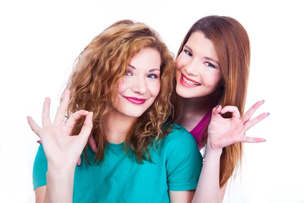 Young lighthearted girls shows Okay gesture — Stock Photo, Image
