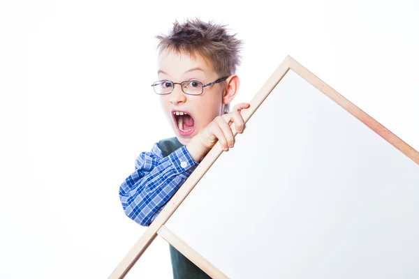 Portrait of cheerful boy pointing to banner — Stock Photo, Image