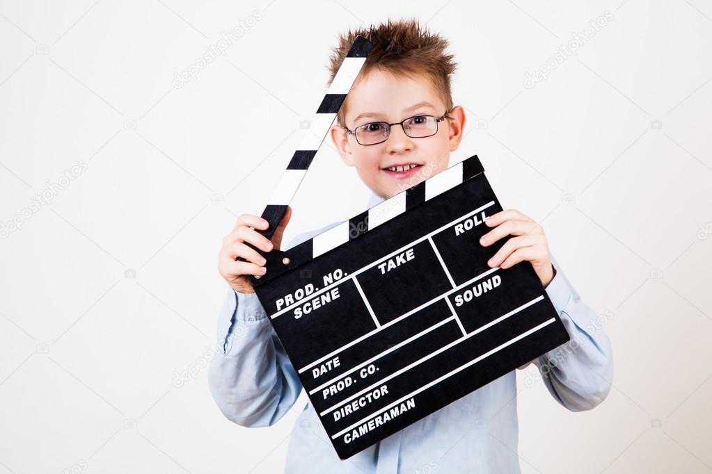 Boy holding clapper board