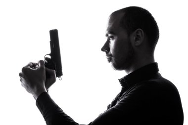 Kaukasische one-man houden pistool portret silhouet