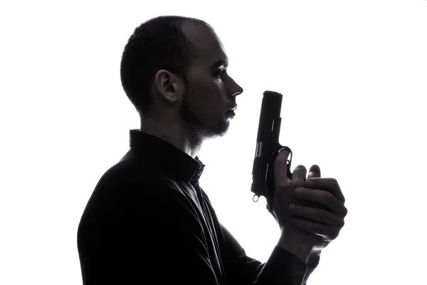 One caucasian man holding gun portrait silhouette — Stock Photo, Image