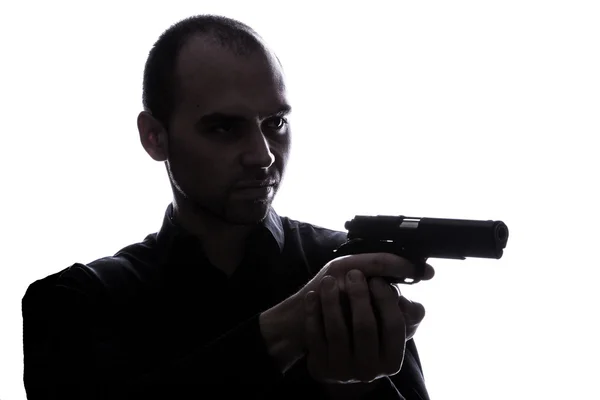 One caucasian man holding gun portrait silhouette — Stock Photo, Image