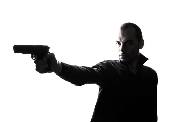 One caucasian man holding gun portrait silhouette — Stock Photo, Image